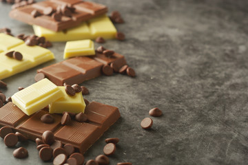 White and milk chocolate isolated. Top view of various chocolate bars with copy space.