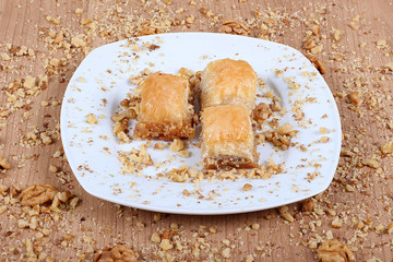 best turkish baklava cevizli Together with pistachios on a white plate