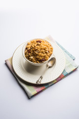 Traditional Jaggery Rice or Gur wale chawal in Hindi, served in a bowl with spoon. selective focus