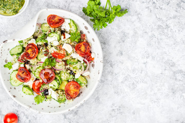mediterranean couscous salad with fried cherry tomatoes, cucumber