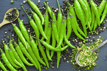 Hot green pepper. Chilean pepper on a black.