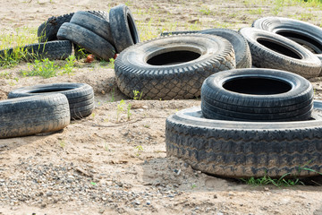 Dump of old car tires. Used car tires.