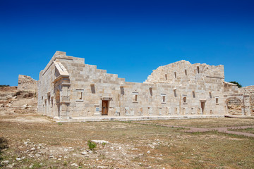 Obraz premium Patara (Pttra). Ruins of the ancient Lycian city Patara. Amphi-theatre and the assembly hall of Lycia public. Patara was at the Lycia (Lycian) League's capital. Aerial view shooting. Antalya, TURKEY