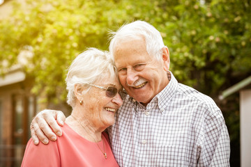 old beautiful couple laughing and hug each other