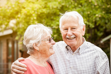 elderly senior couple hug each other