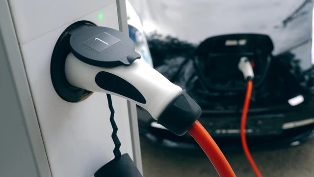 Discharge nozzle is recharging the electromobile