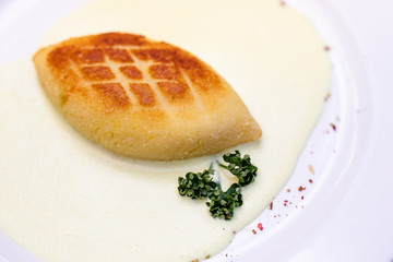 Meat-filled potato pancakes, traditional Lithuanian food on metal pann