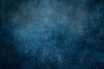 Fototapeta na wymiar Dark blue grungy background or texture