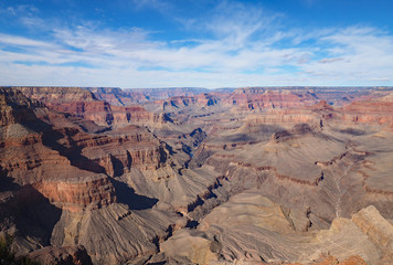 View of the Grand Canyon under a complex cloudscape from the South Rim Trail in Grand Canyon National Park, Arizona, in winter.