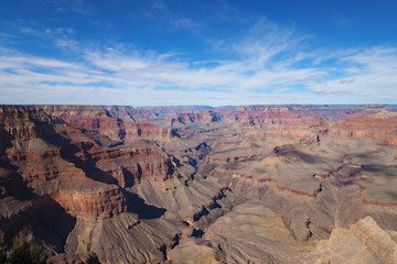 View of the Grand Canyon under a complex cloudscape from the South Rim Trail in Grand Canyon National Park, Arizona, in winter.