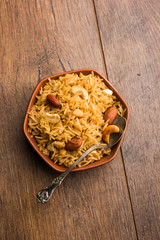 Traditional Jaggery Rice or Gur wale chawal in Hindi, served in a bowl with spoon. selective focus