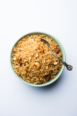 Traditional Jaggery Rice or Gur wale chawal in Hindi, served in a bowl with spoon. selective focus