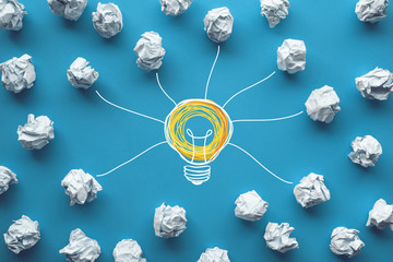 Creativity inspiration,ideas concepts with power of lightbulb and paper crumpled ball on color...