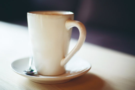Blurred image of white coffee cup