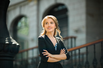 Fototapeta premium portrait of a beautiful young woman in a black suit