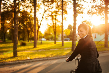 Beautiful lady cycling on a sunny day.