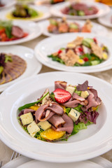 Food Table Celebration Delicious Party Meal Concept. A lot of food. Served for wedding, anniversary, other holiday. Banquet dishes in the restaurant