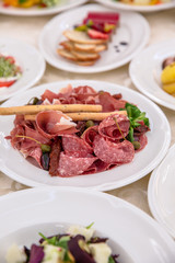 Food Table Celebration Delicious Party Meal Concept. A lot of food. Served for wedding, anniversary, other holiday. Banquet dishes in the restaurant