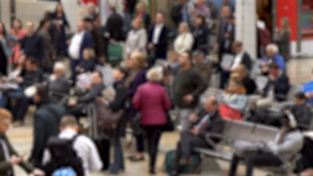 Crowd of Anonymous Travelers Waiting on Seats in Airport After Many Flights Got Cancelled