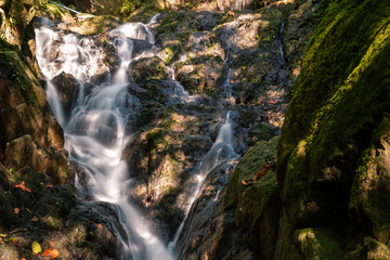 Fototapeta premium Ton Sai Waterfall in the tropical forest area In Asia, suitable for walks, nature walks and hiking, adventure photography Of the national park Phuket Thailand.