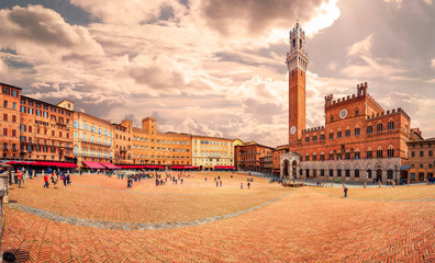 Panorama of Piazza del Campo (Campo square), Palazzo Pubblico and Torre del Mangia (Mangia tower) in Siena, Tuscany, Italy. - obrazy, fototapety, plakaty