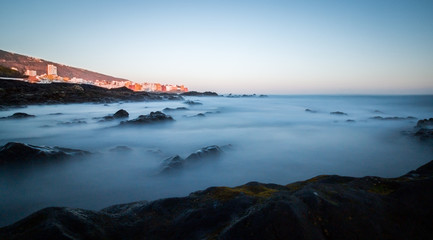 Creative long-term exposure with a view from the beach along the coast