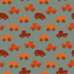 A seamless vector pattern with red and orange toy cars. Surface print design for children.