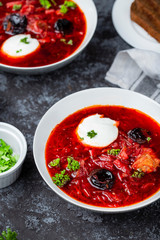 Traditional borscht with prunes and sour cream