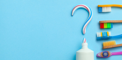 Question mark from toothpaste. The concept of choosing good toothpaste for teeth whitening. Tube of...