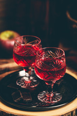 Glass of red liquor with chocolate bars