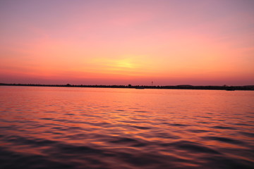 Naklejka premium SUNSET VIEW FROM SEA SHORE - BEACH BANK