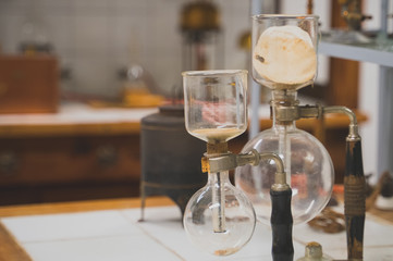 Old heating mantle and flasks in a chemical laboratory.