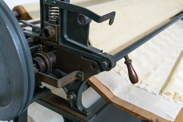 Pleating machine. Gives the silk pleats with various design.