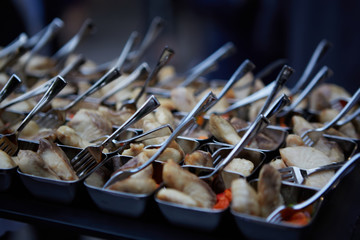 Fototapeta premium Background of catering Buffet assorted Snacks from fish prepared for wedding guests of a party or birthday