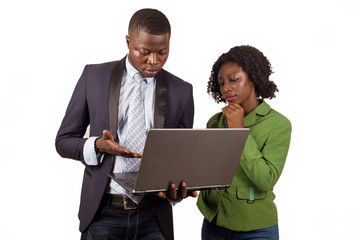 businessman and businesswoman working on laptop