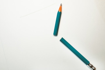 no white paper thrown broken green pencil