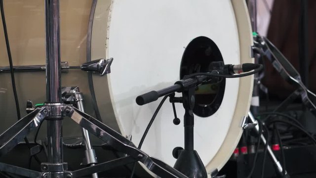 Bass drum in action. Single kicks in the bass drum. Close-up footage. Slow motion.