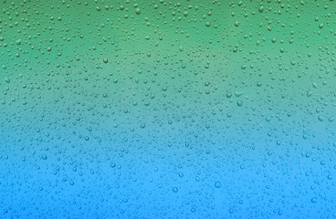 Water drops on glass - abstract background.