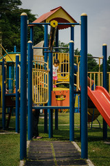 Fototapeta na wymiar Colorful playground on yard in the park.