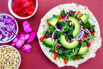 Healthy Vegetarian Avocado Salad on a Pizza Base