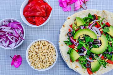 Healthy Vegetarian Avocado Salad on a Pizza Base