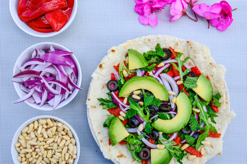 Healthy Vegetarian Avocado Salad on a Pizza Base