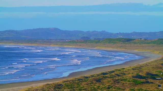 Mar Brava beach on the island of Chilo&eacute; on a sunny day and gentle waves of the Pacific Ocean
