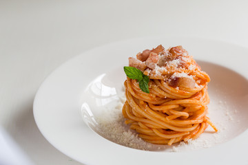 Homemade Amatriciana - Italian pasta based on guanciale (cured pork cheek), pecorino cheese,...