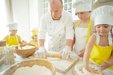 Culinary Master Class. Children in the kitchen are cooking. 