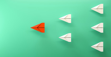 paper plane leadership concept - red paper plane leading the row