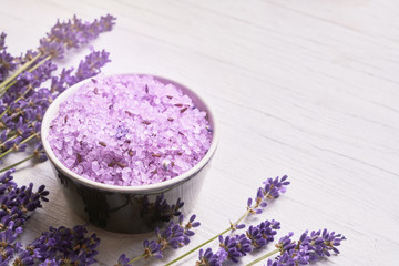 Lavender SPA. Lavender flowers and bath salt in bowl on white background. Copy space, top view. SPA concept