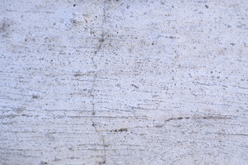 Detail of a gray wall close up. Cinderblock garage, detailing the outside of the garage wall