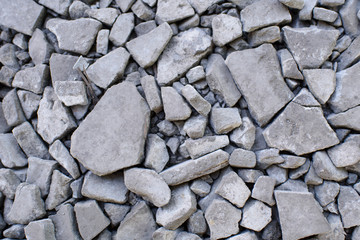 Ground stone gray background of a large number of small stones