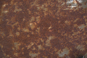 Strongly worn iron rusty wall from a large garage